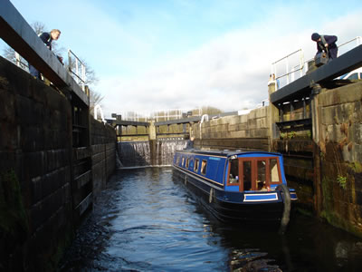 Marine Cruises narrowboat in a lock in Scotland